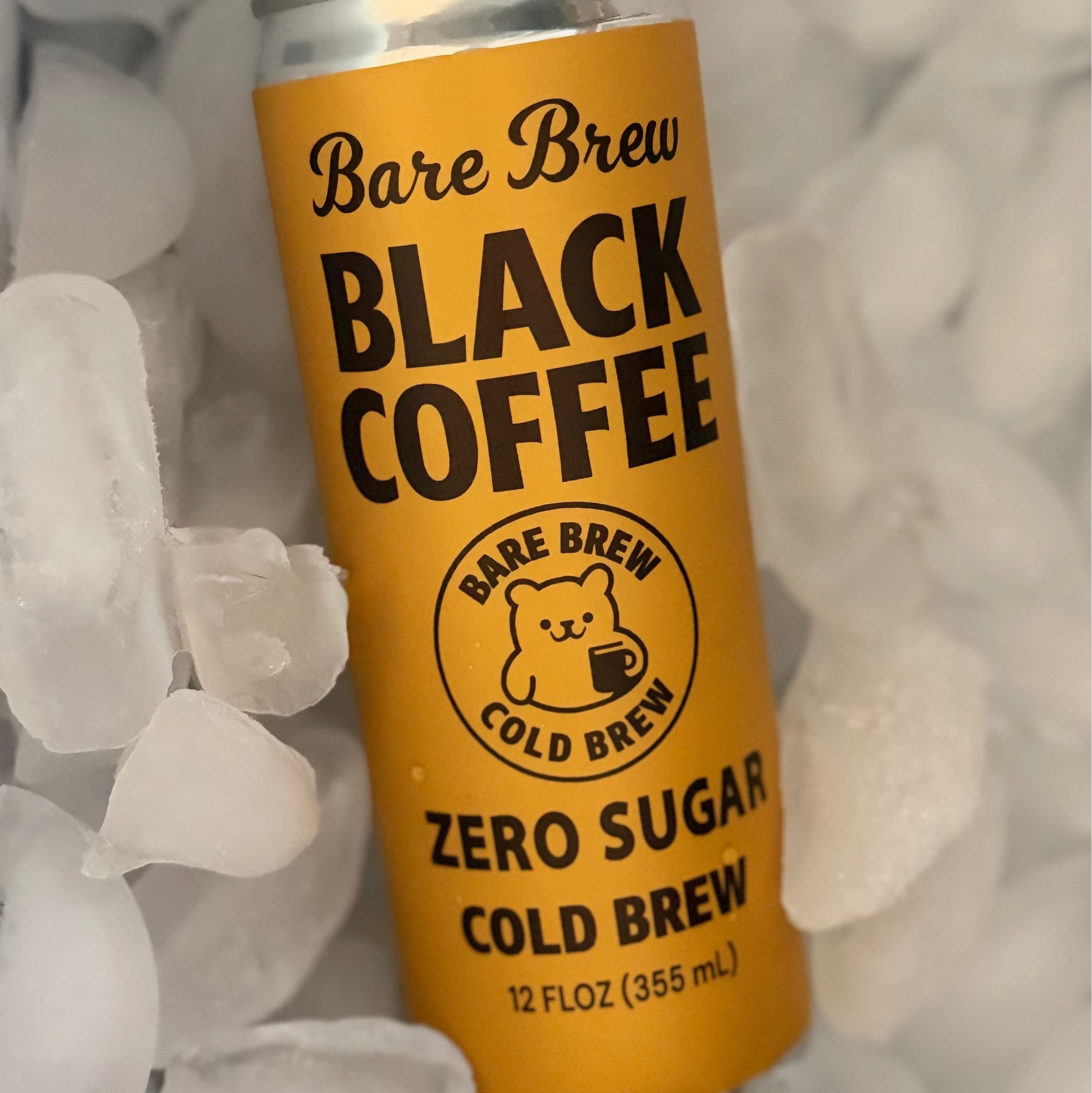 Can of Bare Brew Black Coffee Shelf Stable Cold Brew Shipped with ice cubes in the background